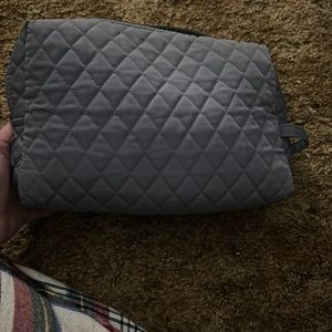 Used gray Vera Bradley large cosmetic bag.